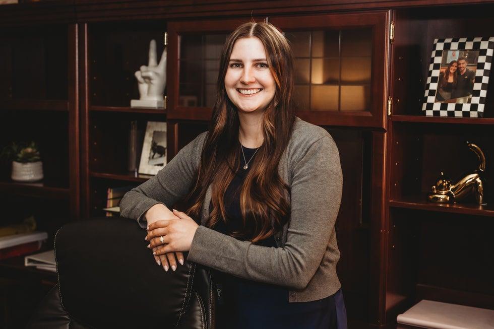 Higher Level Legal team member smiling in the office