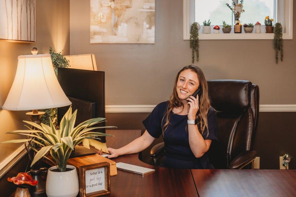 Higher Level Legal team member on the phone at the front desk