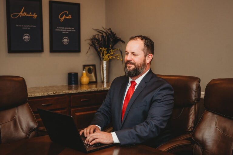 Higher Level Legal attorney working on a laptop in the office